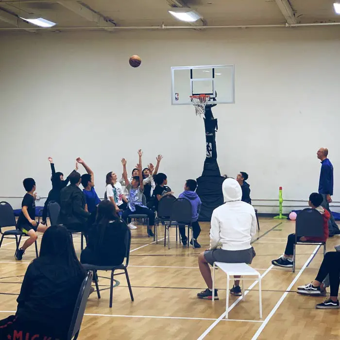 LIFE Group members and youth enjoying a gym activity together